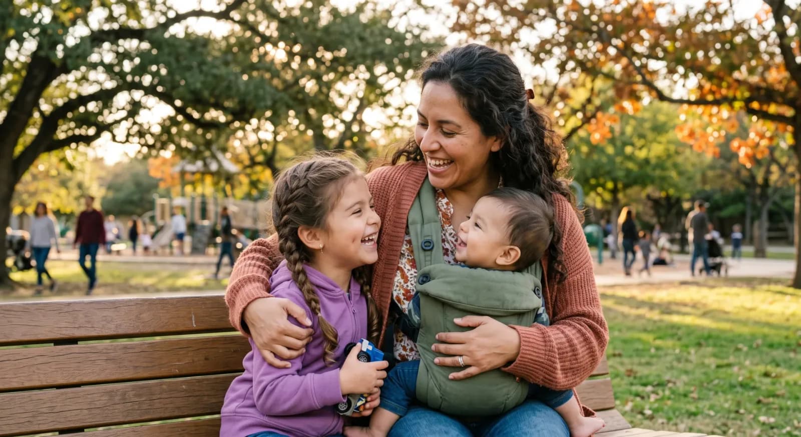 A mom spending time at the park with her children
